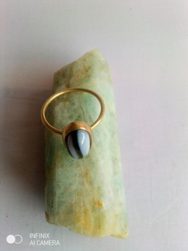 Ring made by bronze material and stone black onex